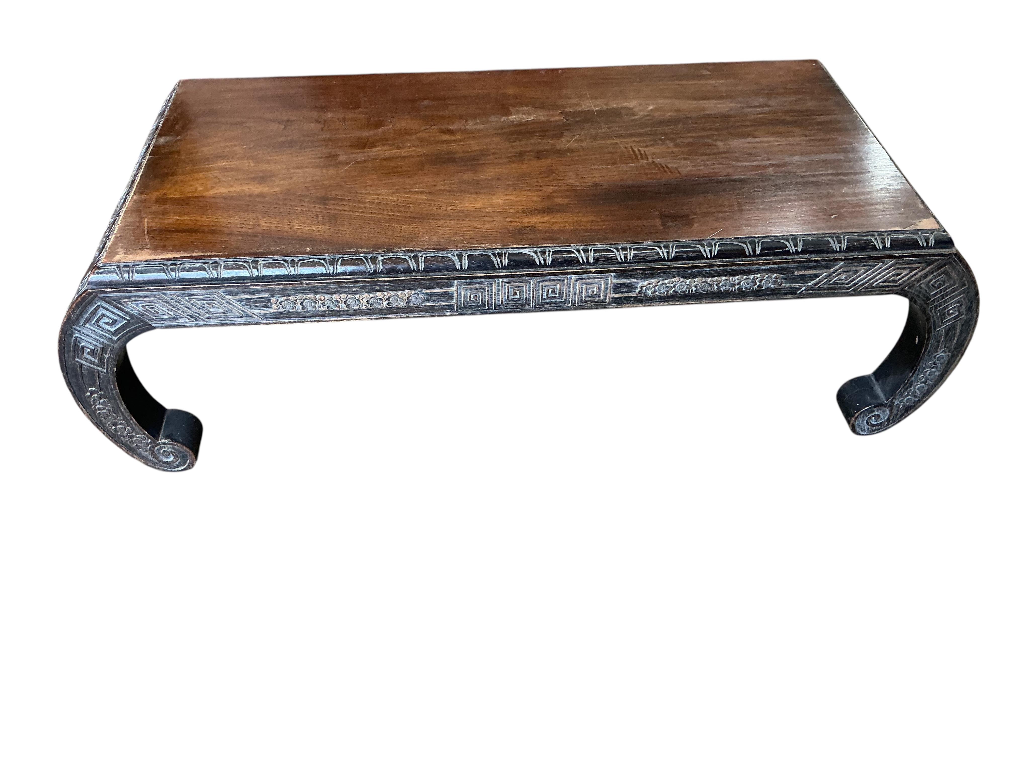 A Chinese carved low table, width 92cm, depth 40cm, height 28cm